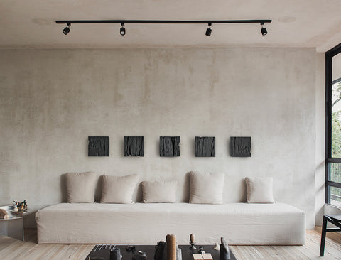 minimalist black wall art set above sofa