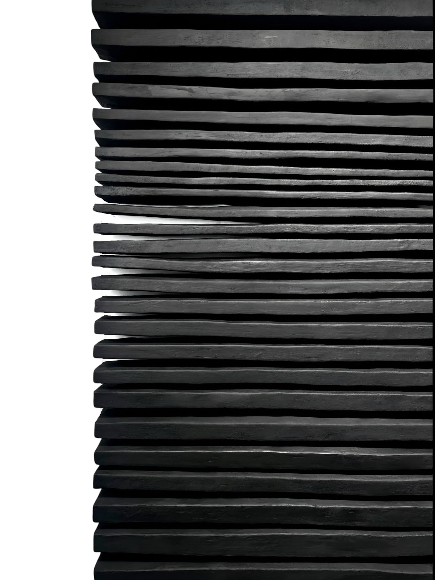 Stack of black and gray pleated paper on a white background