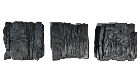 large black charred wood wall sculpture set minimalist living room