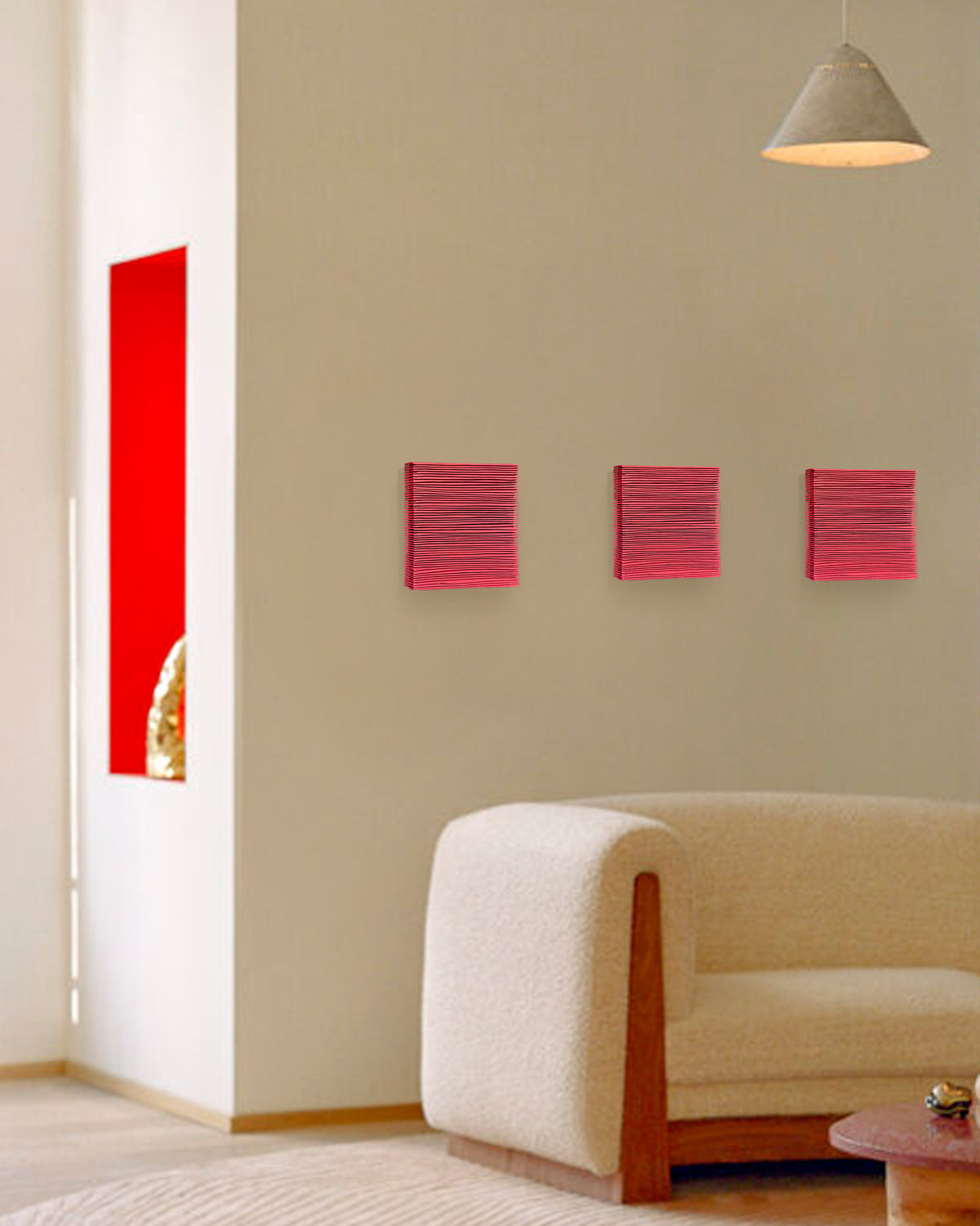 SHADOW — Crimson Study, row of three small red panels above a cream armchair