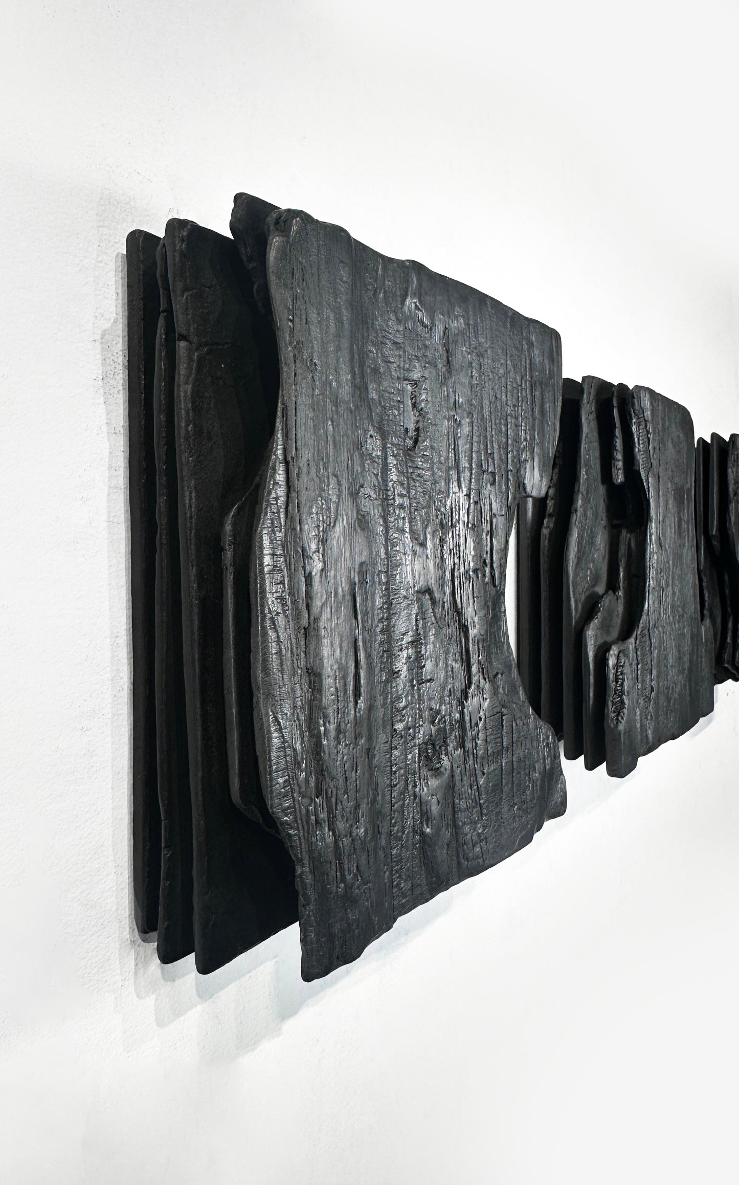 textured charcoal wall sculpture wabi sabi style