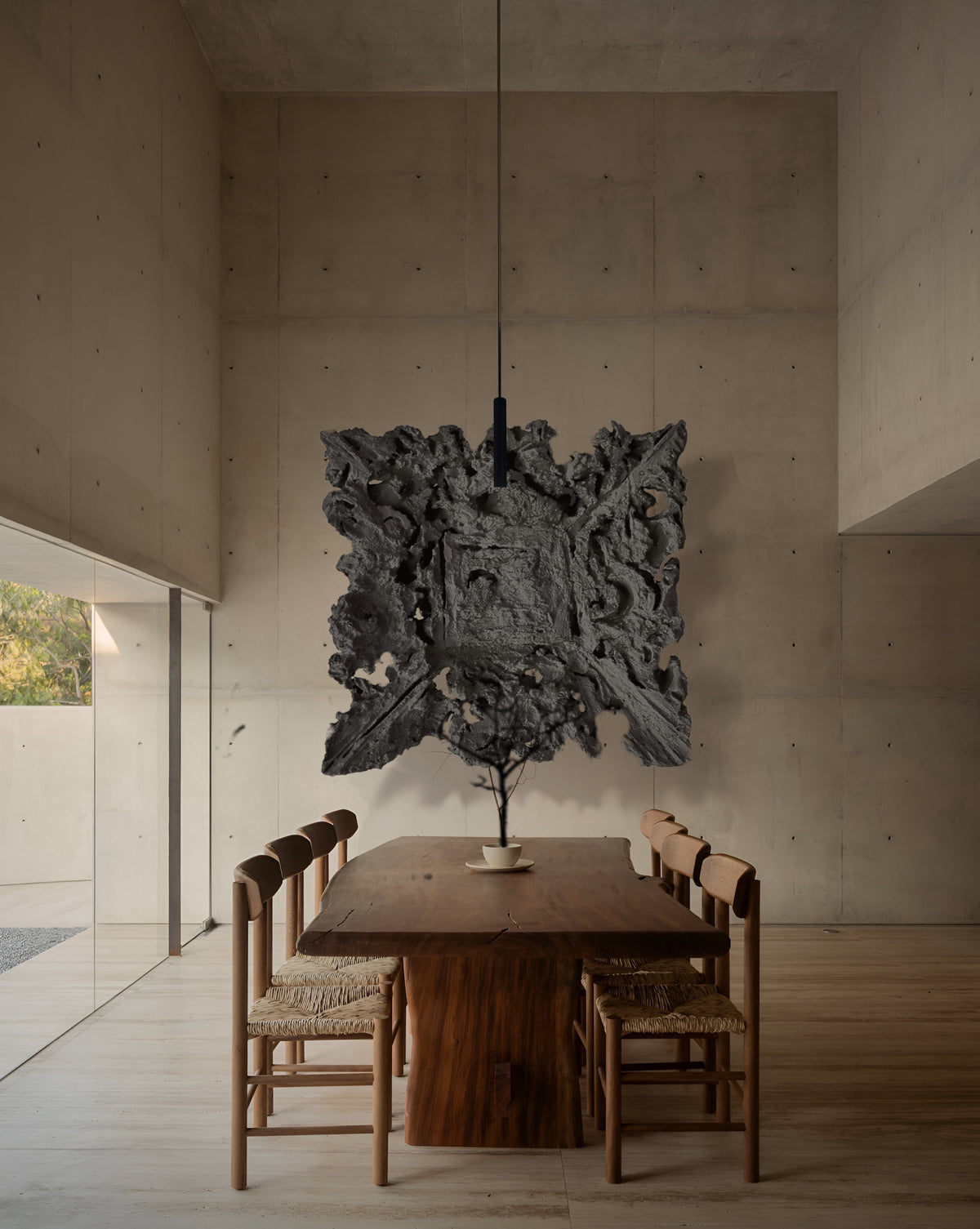 BIJOUX — Charcoal Gray, above a solid wood dining table in a concrete room