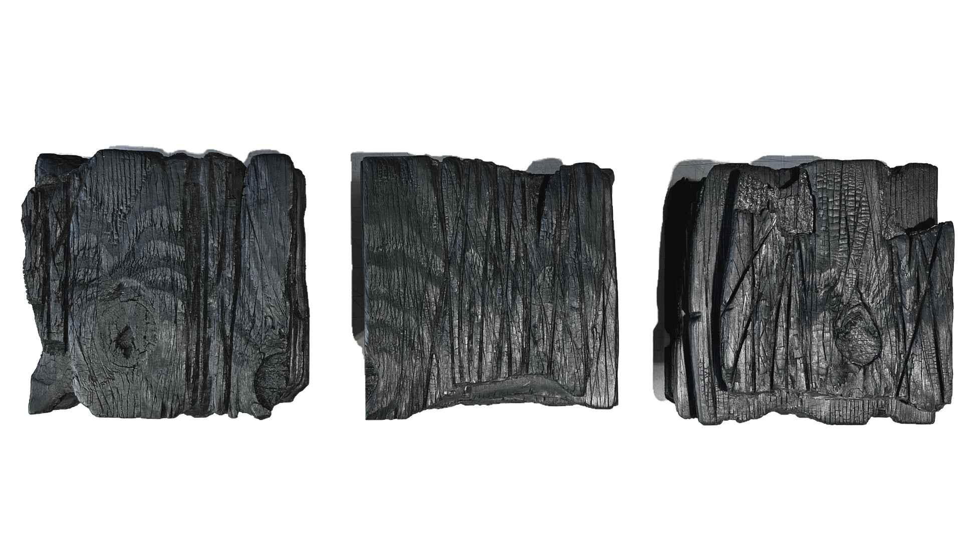 large black charred wood wall sculpture set minimalist living room