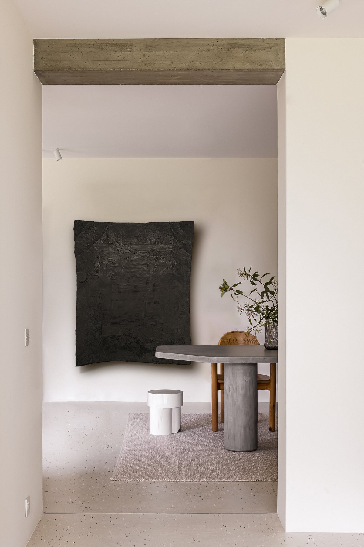 STRATA — Black, large black relief in a calm interior beyond a doorway