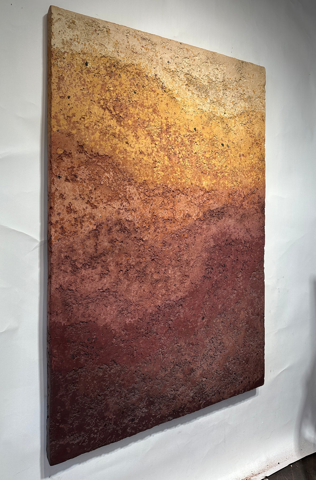 CHROMATERRA detail, aggregate plaster surface in terracotta and umber
