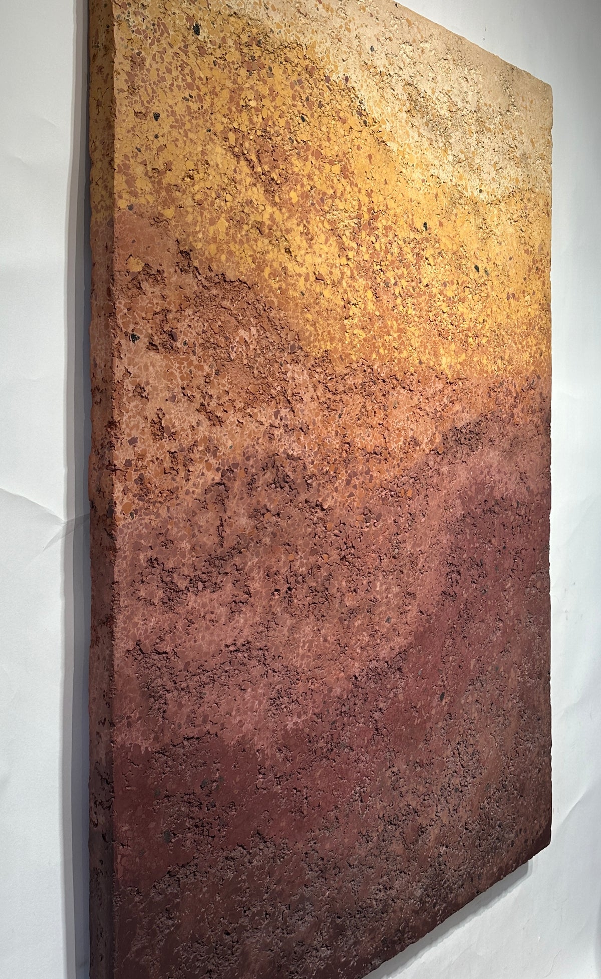 CHROMATERRA detail, aggregate plaster surface in terracotta and umber