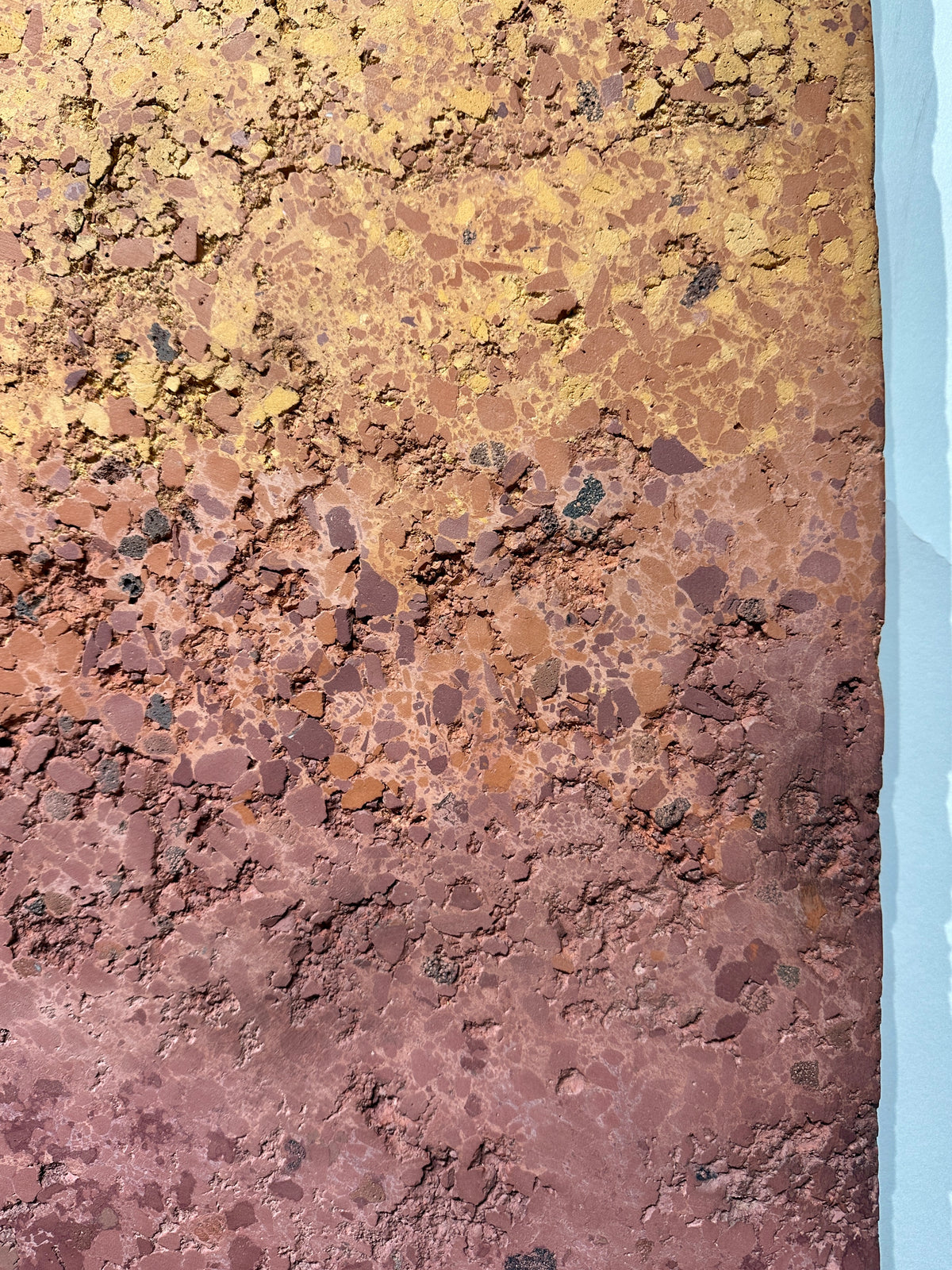 CHROMATERRA detail, aggregate plaster surface in terracotta and umber