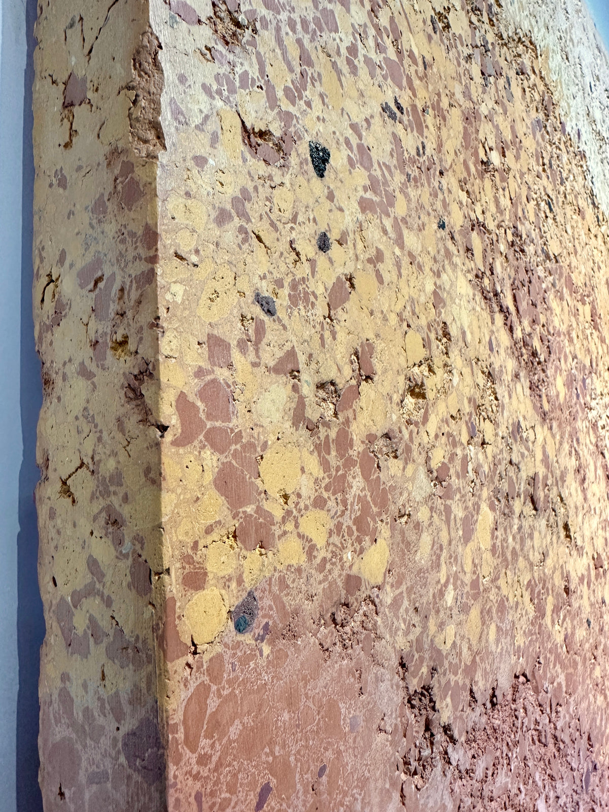 CHROMATERRA detail, aggregate plaster surface in terracotta and umber