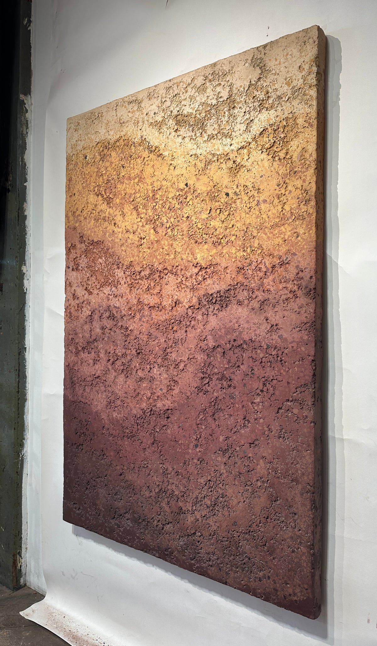 CHROMATERRA detail, aggregate plaster surface in terracotta and umber