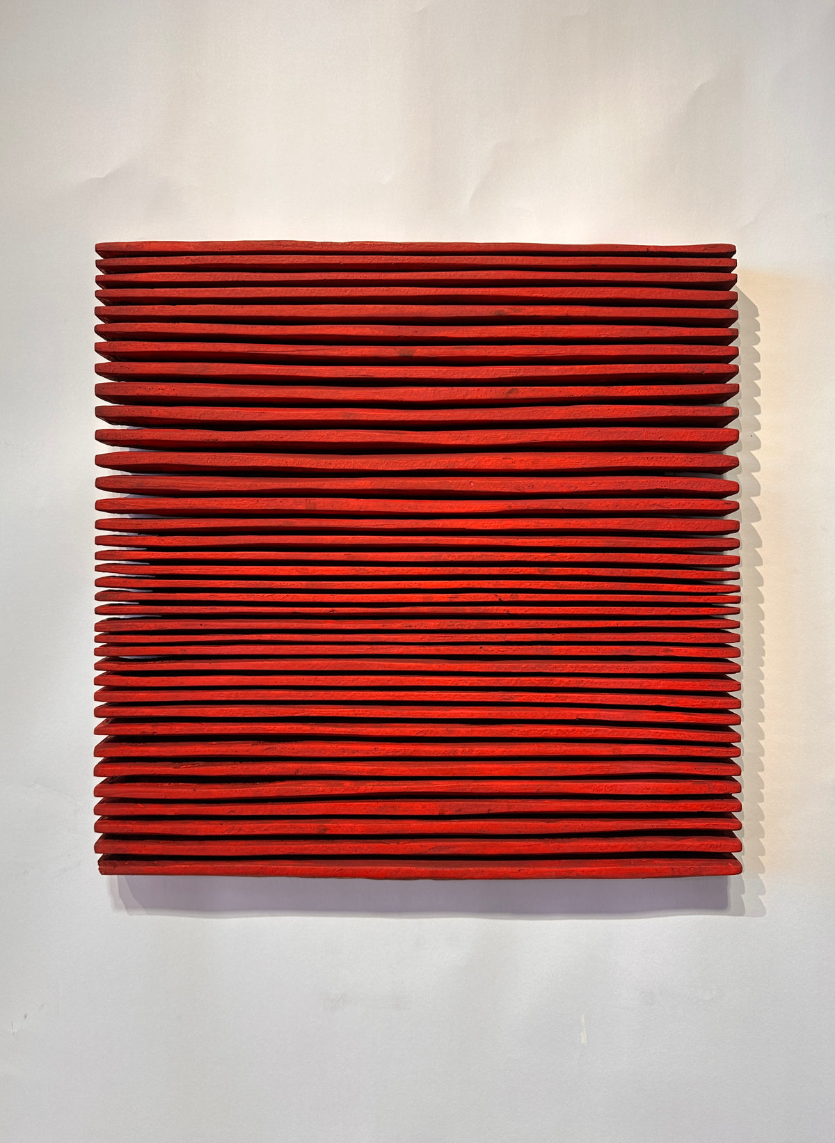 SHADOW — Crimson Study, frontal view, square red relief with dense horizontal ridges, SIZMARI