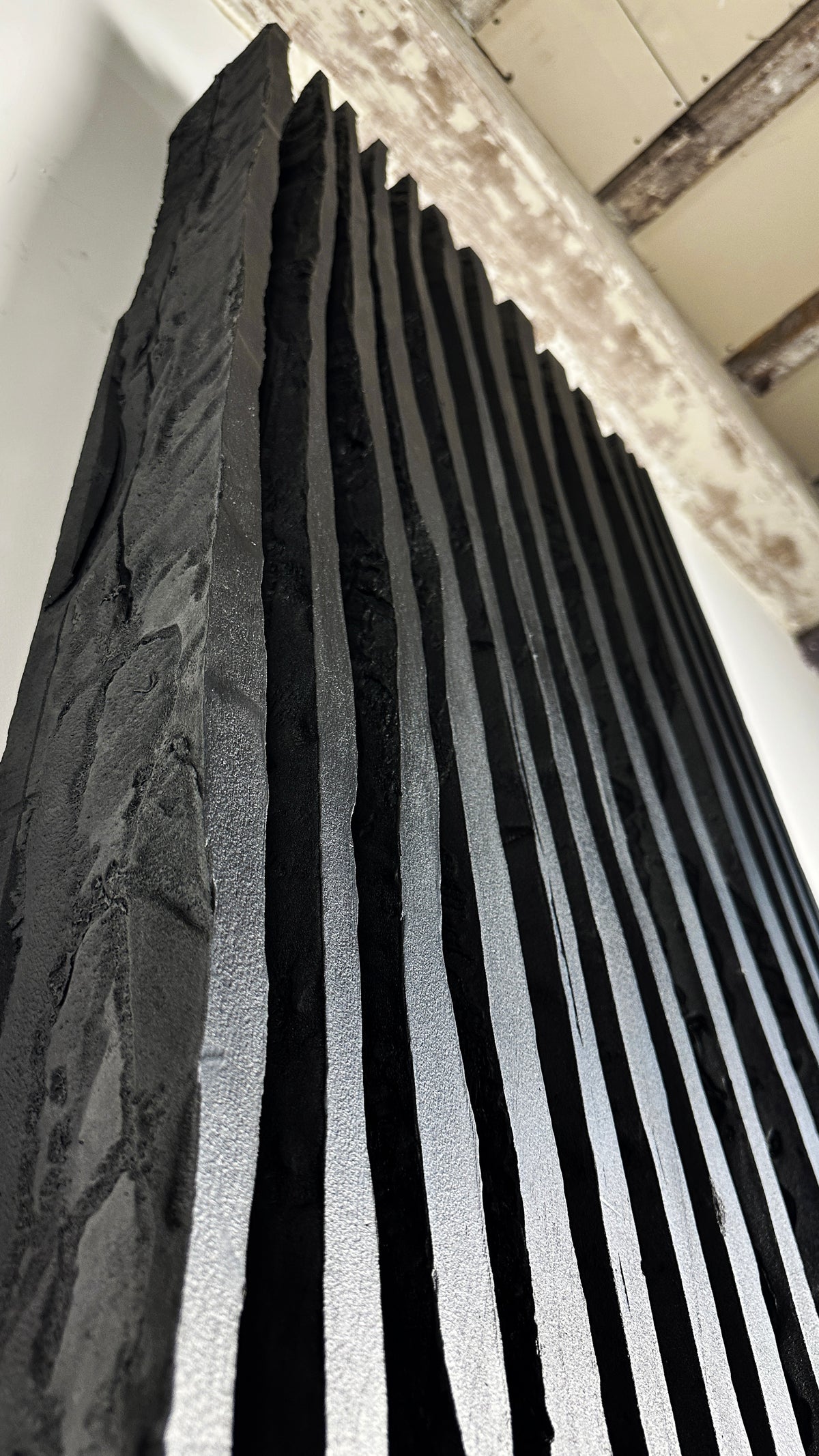 SHADOW — Noir Aurora, studio detail, individual blade texture, mineral black pigment