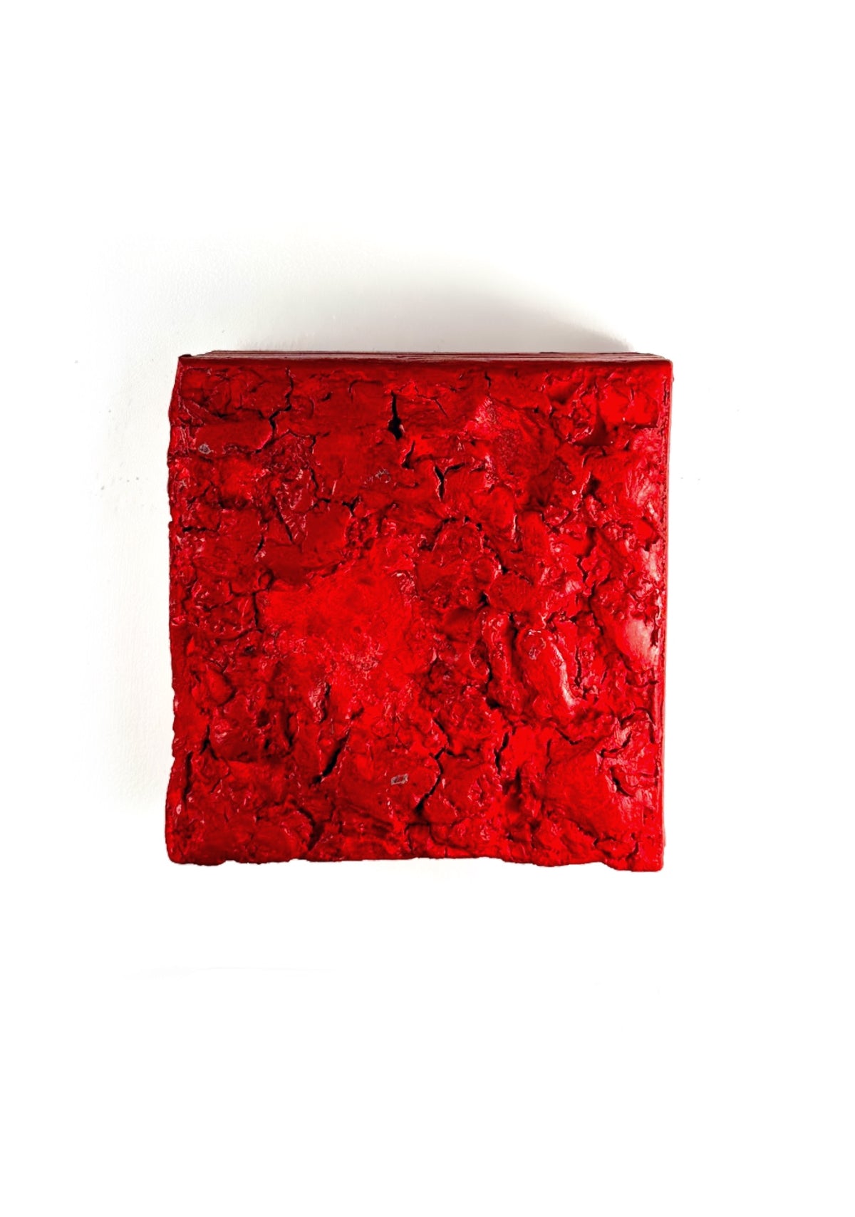 STRATUM — Red, single crimson square with cratered surface, close frontal view