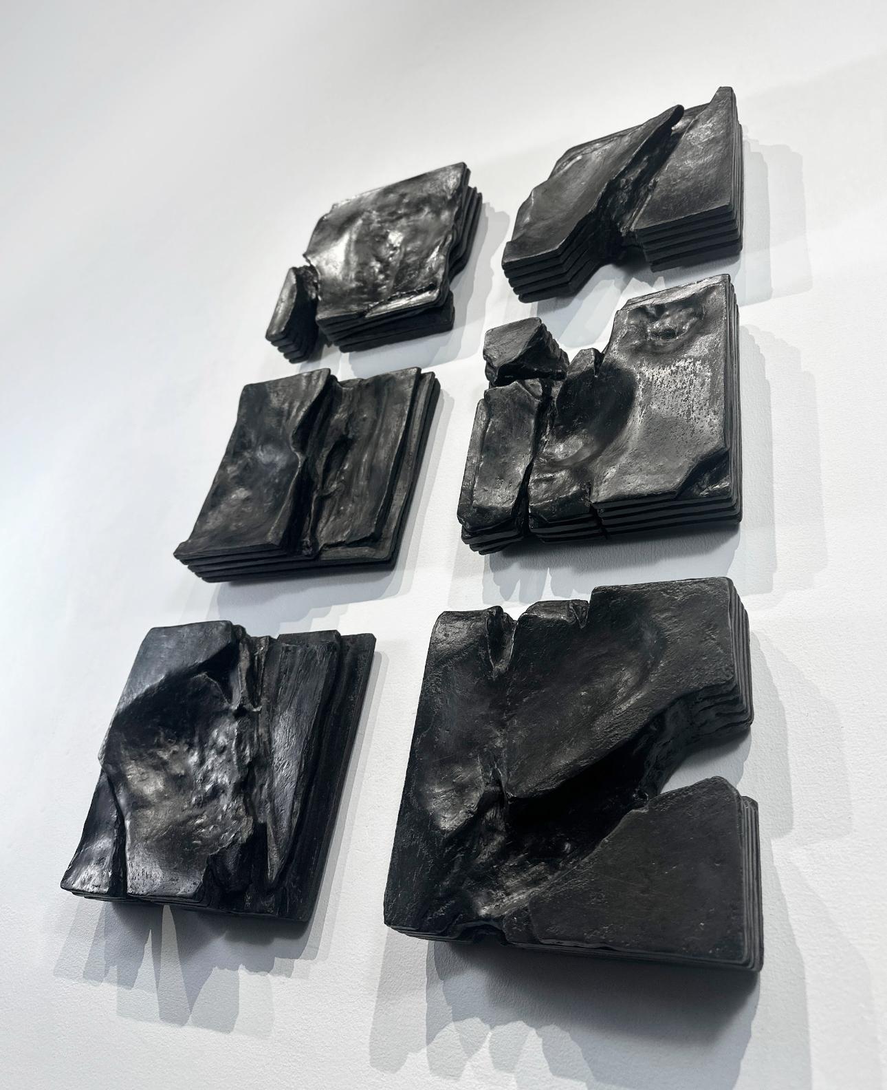 Set of black stone slabs arranged on a white background