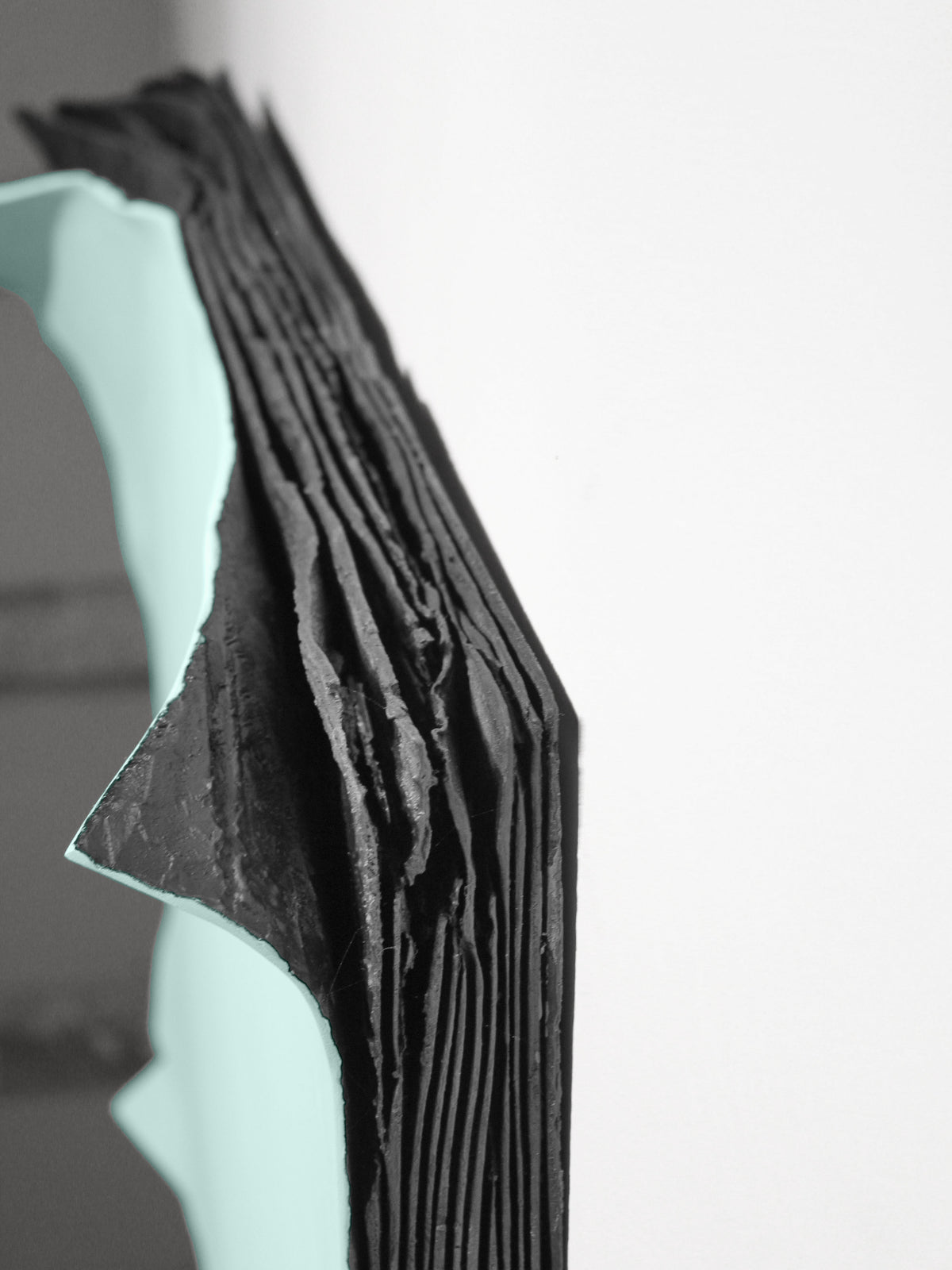 INNER WORLD — Turquoise, edge close-up, black plaster layers beneath turquoise surface