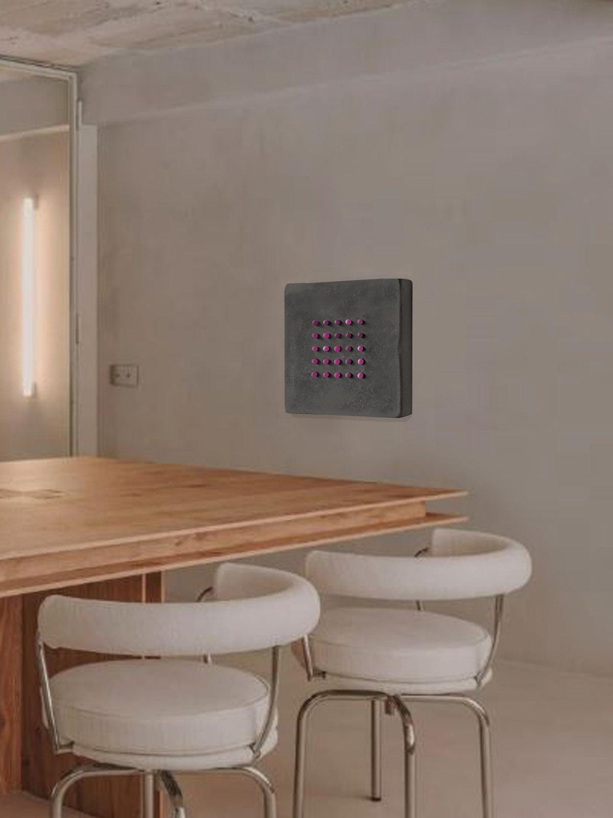 FUNNY DOTS — on Black, dot relief installed above a wood table with white stools