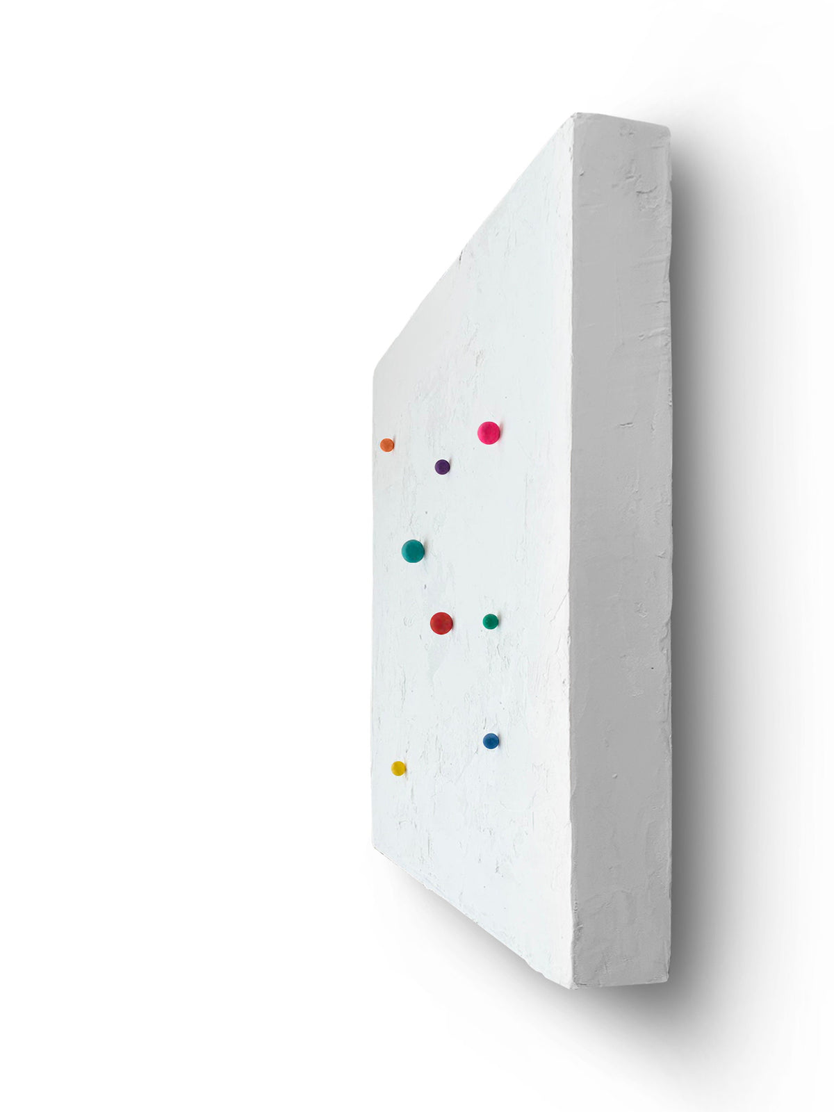 SHUN — White base, side view, colored spheres projecting from white plaster