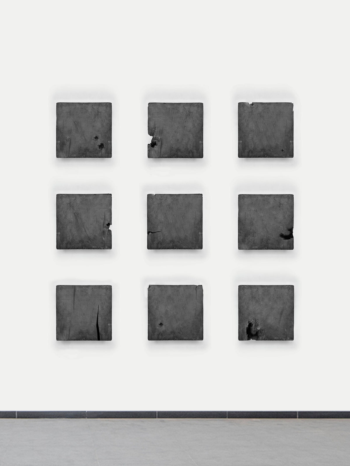 CONCRETICA — Graffiti Grey, three by three grid of square panels, frontal view