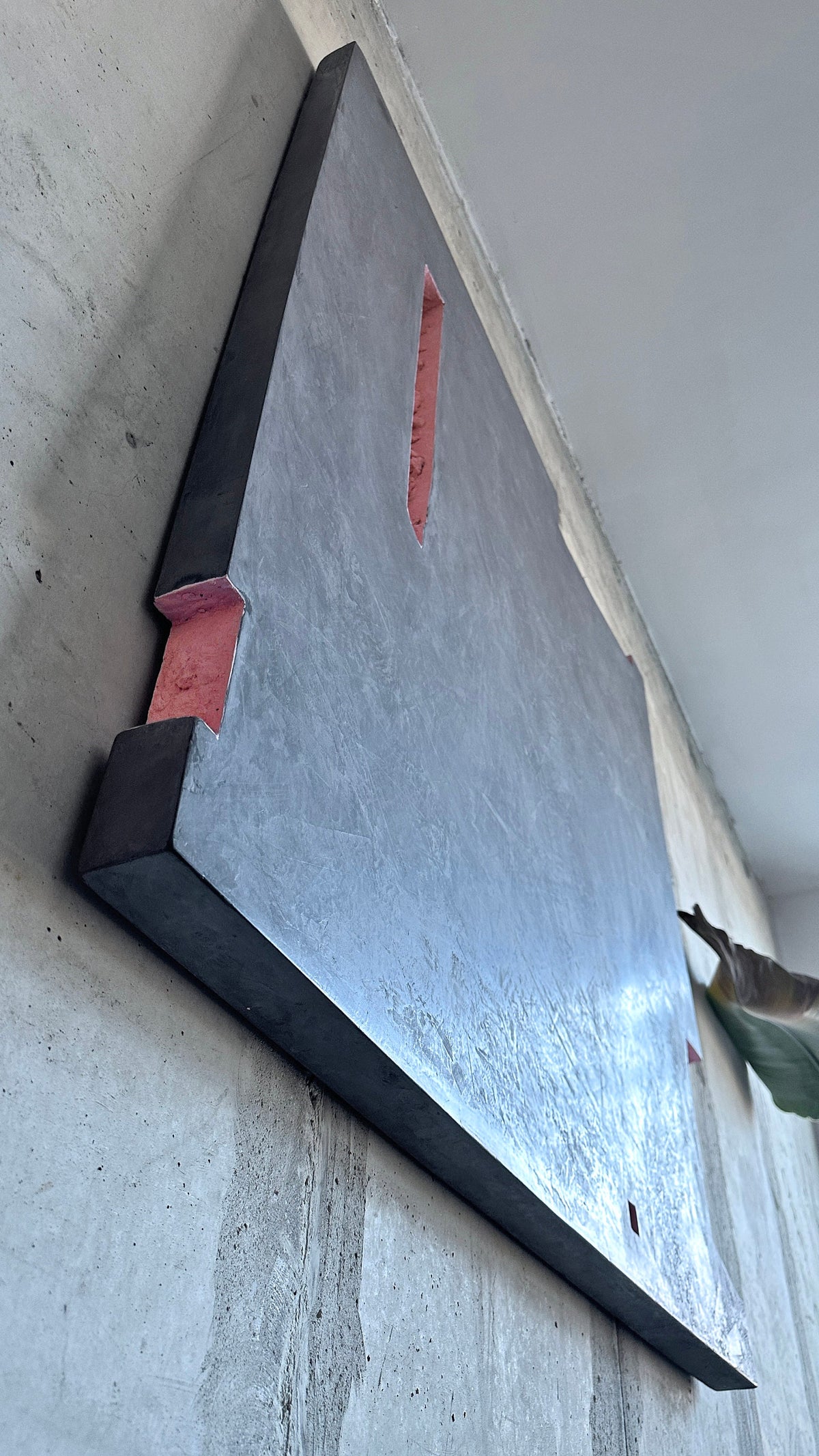 AUSTERE NAUGHTY — side profile along concrete wall, panel edge and pink inset