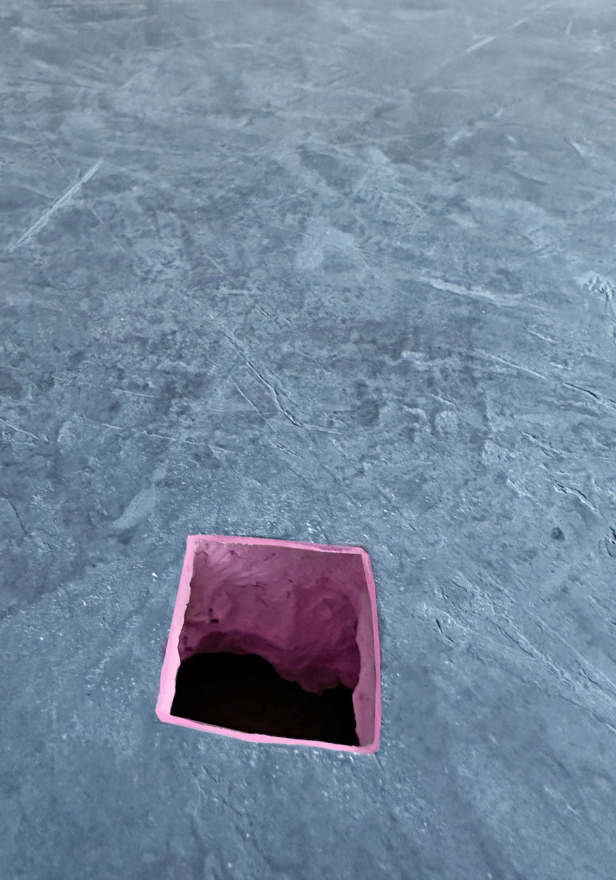 AUSTERE NAUGHTY — close-up of square opening with pink interior in trowelled gray plaster