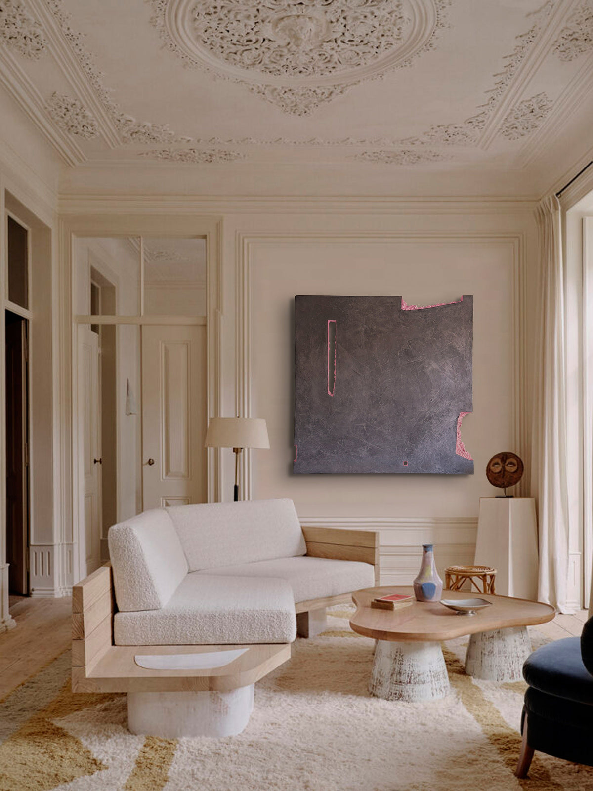 AUSTERE NAUGHTY — large gray relief in a classic living room with molded ceiling
