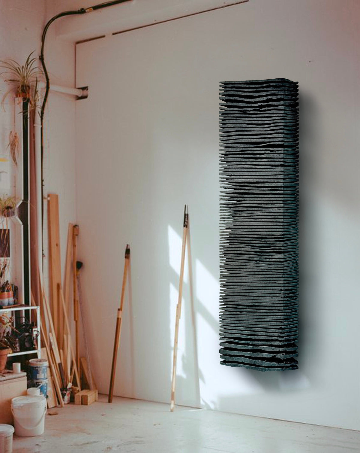 SHADOW — Noir Midnight, narrow column wall sculpture, stacked horizontal ridges, matte black plaster