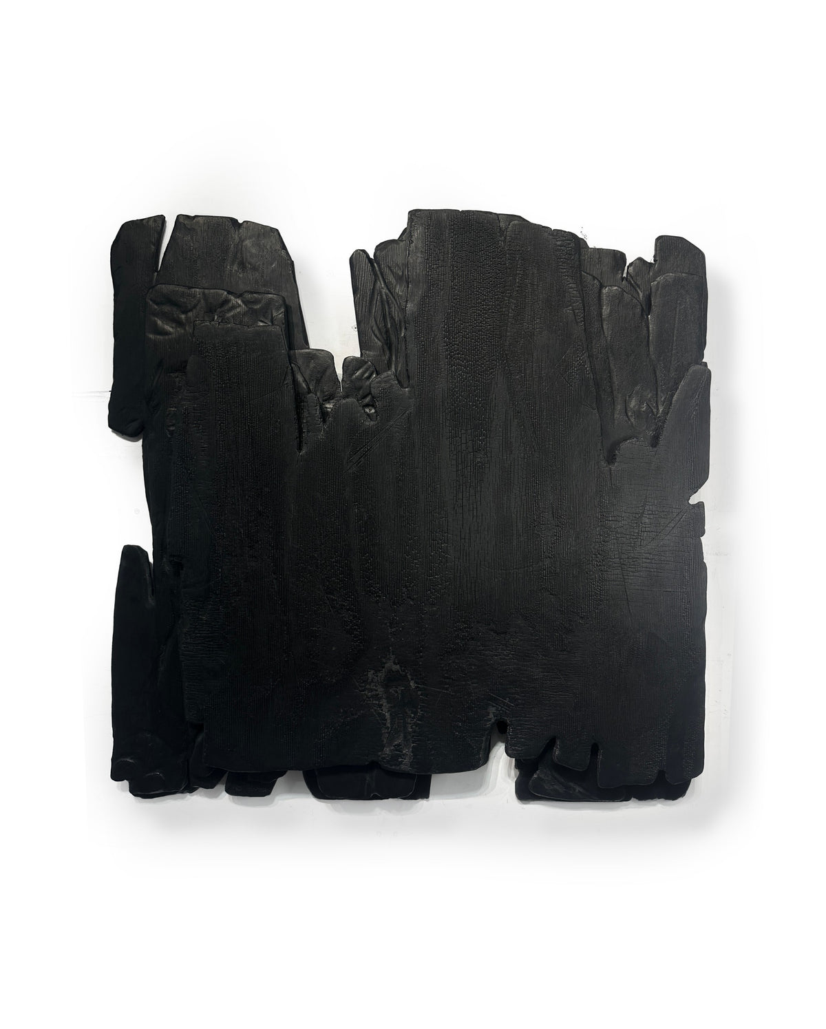 MORI — Charcoal Black, three-quarter view, deep layered relief with carved hollow edge